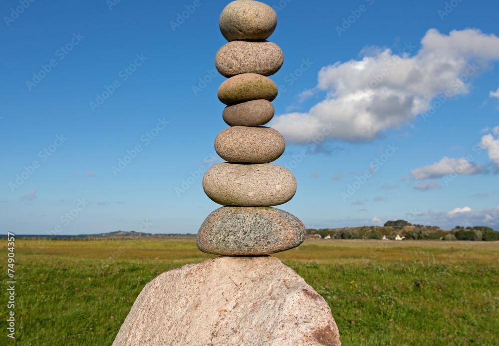 Pile of round smooth stones in sunshine Pile of round smooth stones in sunshine