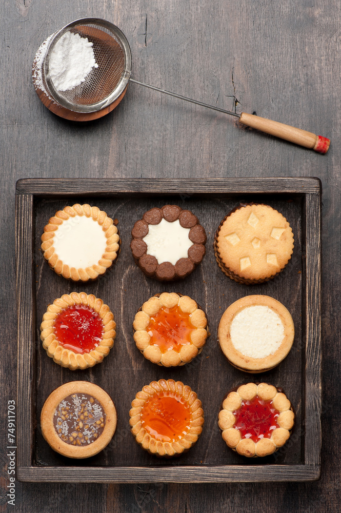 Сookies with chocolate and jam in a wooden box Сookies with chocolate and jam in a wooden box