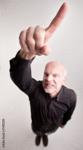 finger of a man telling off in wide angle photo