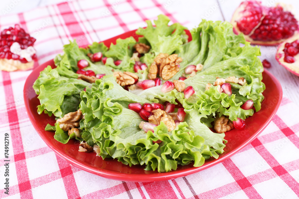 Fresh salad with greens, garnet and spices