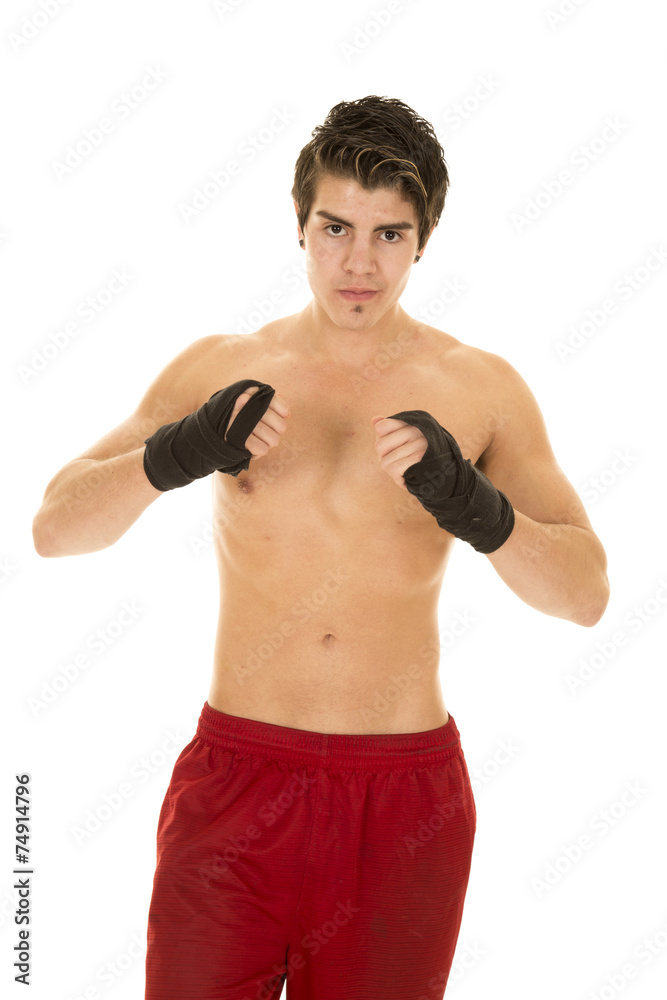 man no shirt red shorts hand wrapped for fighting up