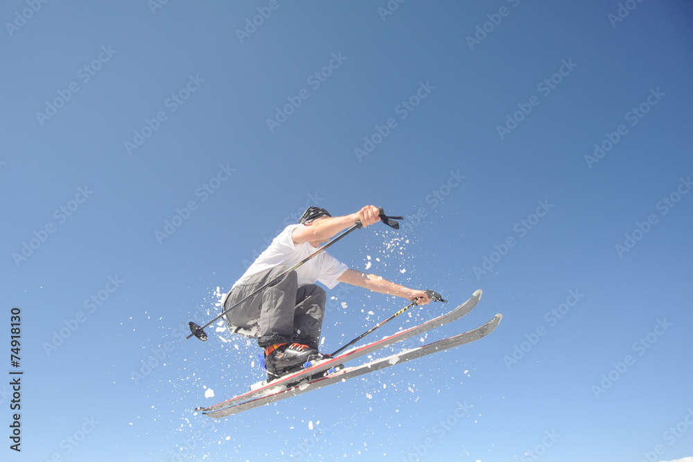 Side view of a person on skis jumping over slope Side view of a person on skis jumping over slope