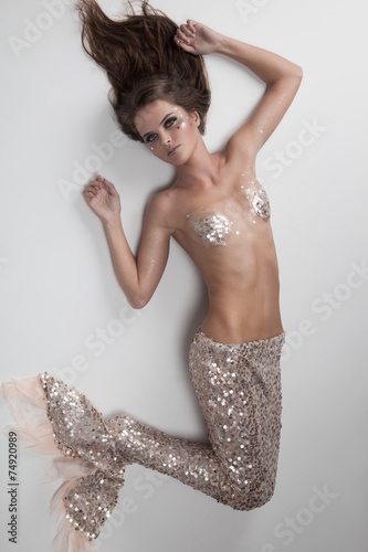 Photos Fashion Fantasy Mermaid. Studio Shot. Gray Background.