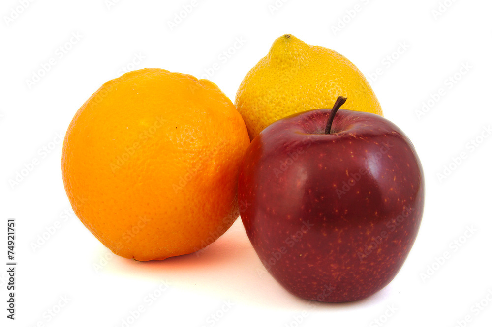 Red apple, yellow lemon and an orange Red apple, yellow lemon and an orange