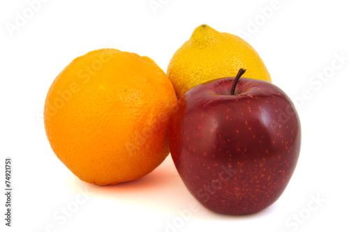 Red apple, yellow lemon and an orange