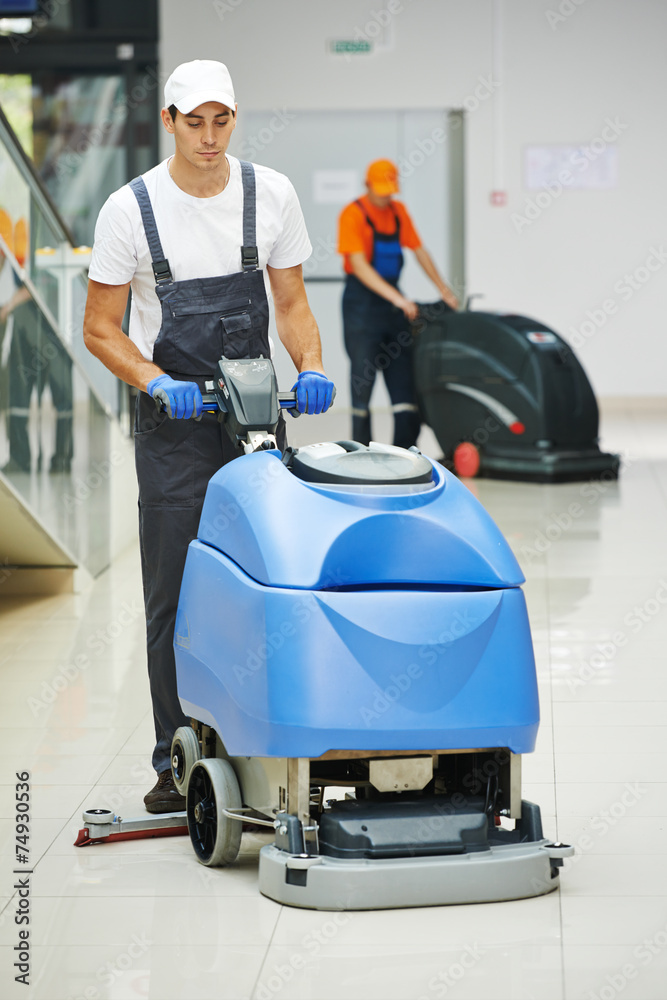 male worker cleaning business hall