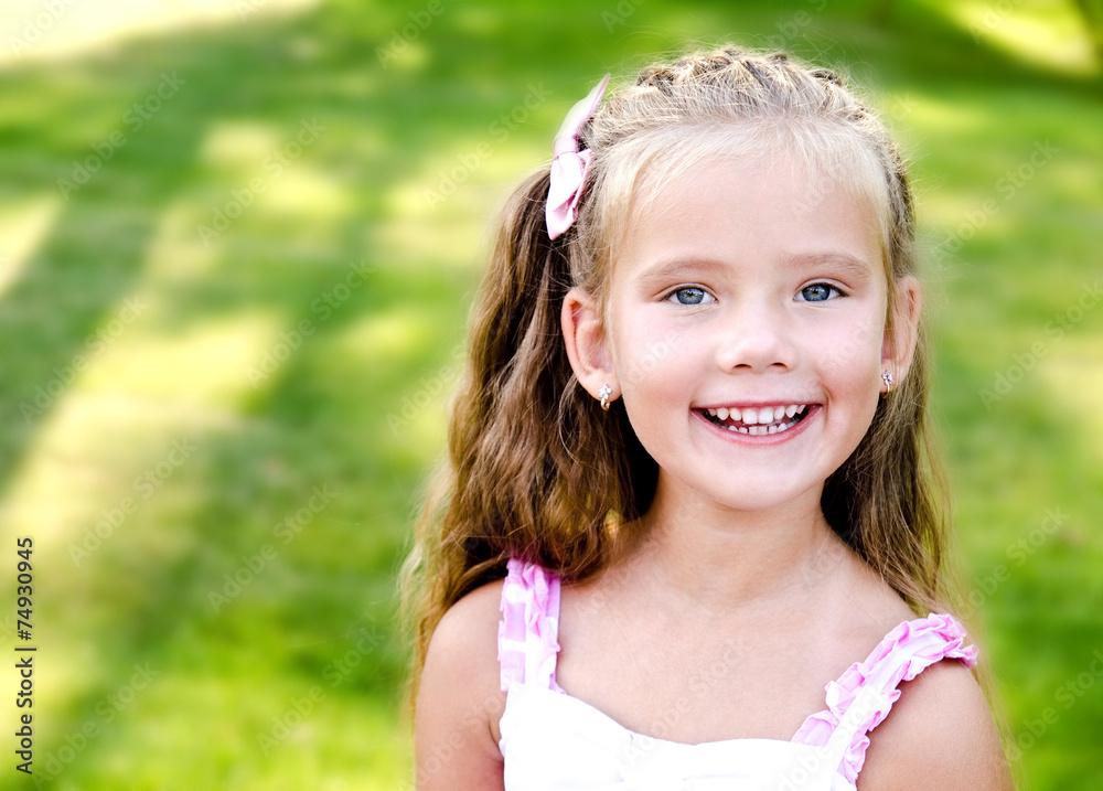 Portrait of adorable smiling little girl in the park Portrait of adorable smiling little girl in the park