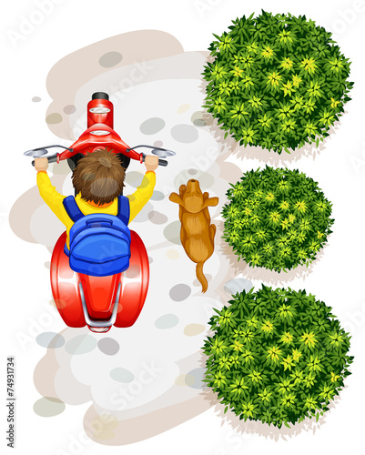 A topview of a boy riding a motorcyle