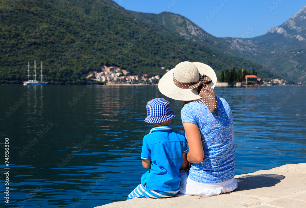 mother and son looking at scenic sea view