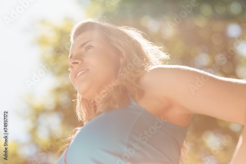 Fototapeta Naklejka Na Ścianę i Meble -  Fit blonde enjoying the sunshine