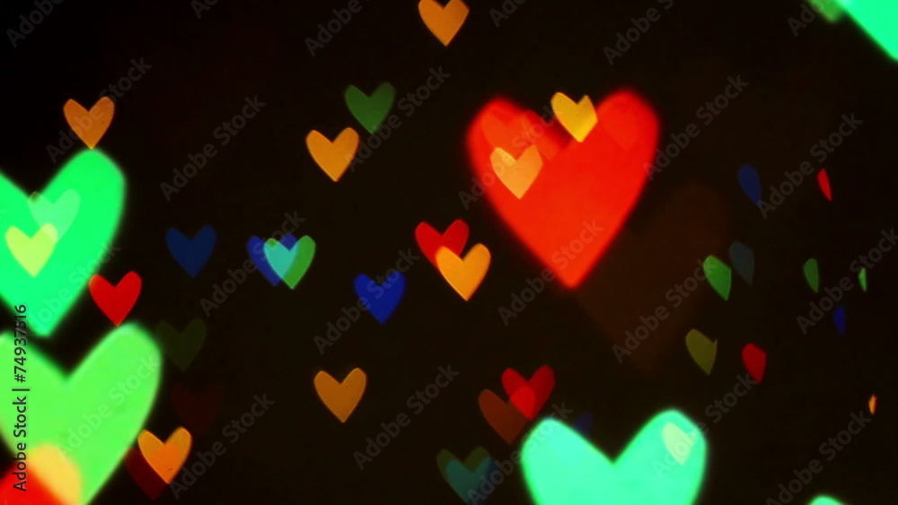 Colorful defocused blinking heart bokeh festive lights