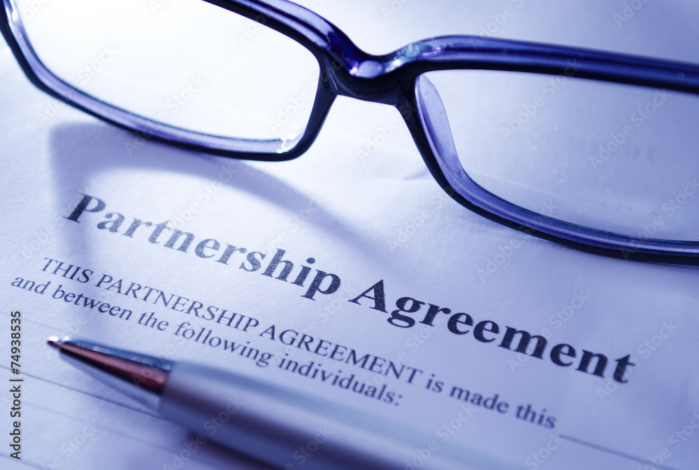 Close up Glasses and Pen on Top of Agreement Paper Close up Glasses and Pen on Top of Agreement Paper