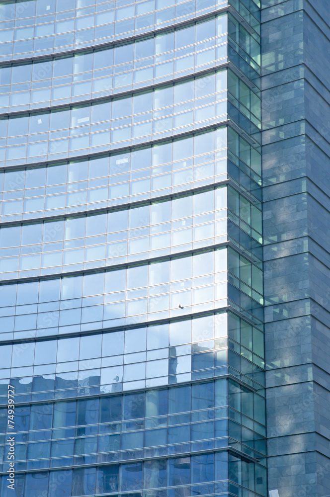 Glass Facade of company building with reflection of blue sky. Glass Facade of company building with reflection of blue sky.