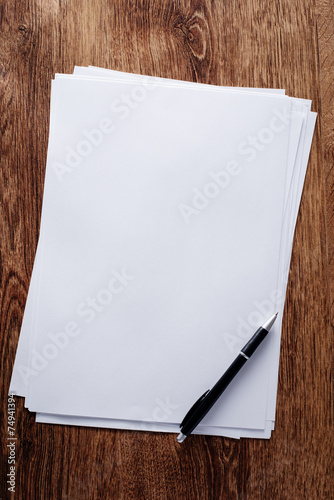 Clean Bond Papers and Pen on Top of Table