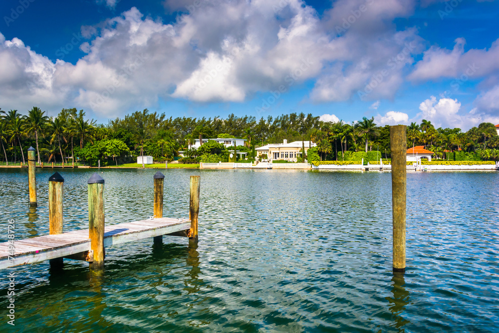 Dock and houses along Collins Canal in Miami Beach, Florida. Dock and houses along Collins Canal in Miami Beach, Florida.