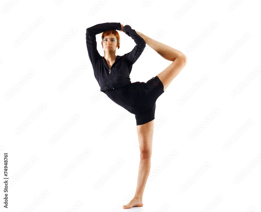 Young girl doing gymnastics exercise isolated over white Young girl doing gymnastics exercise isolated over white