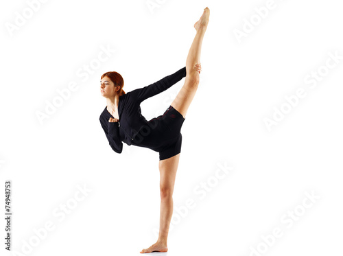 Modern ballet dancer doing split standing