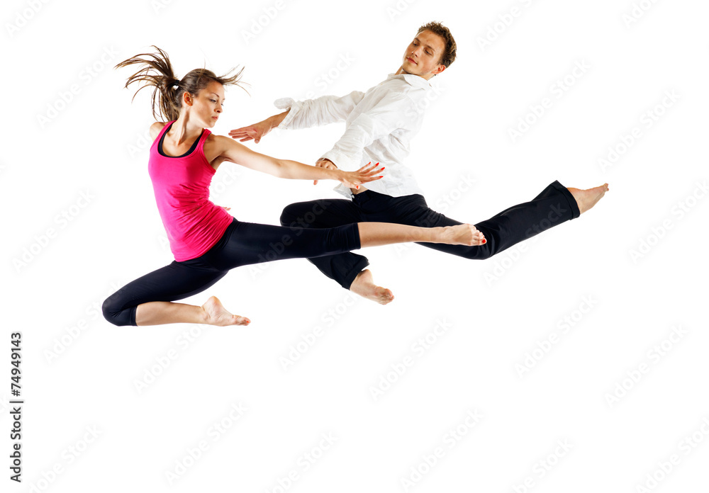 Modern ballet dancers, male and female in the jump
