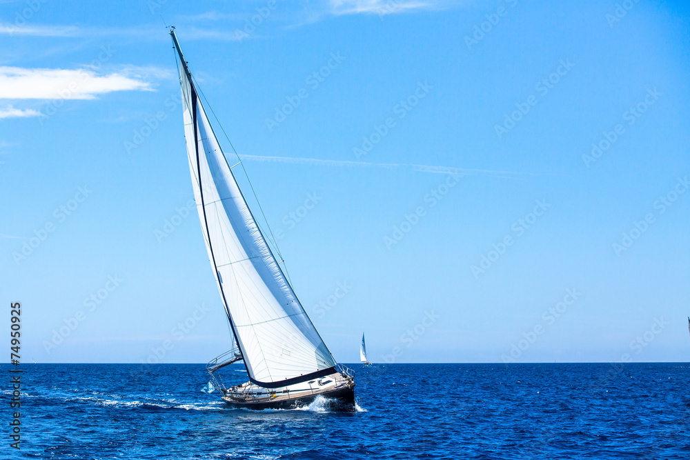 Sailing. Sailboat participate in sailing regatta. Luxury yachts.