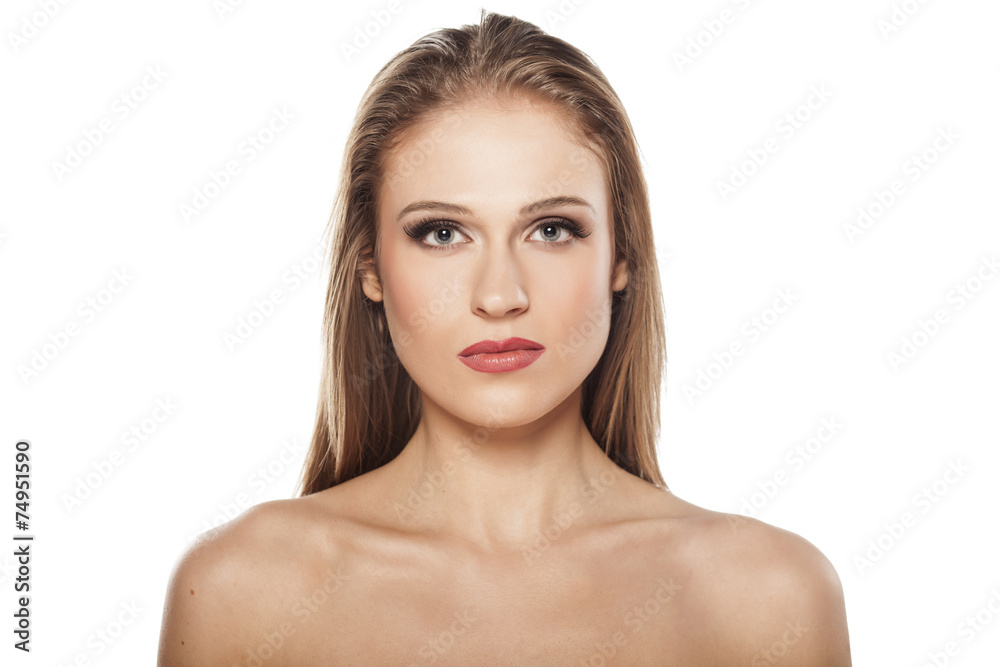 serious beautiful blonde on a white background