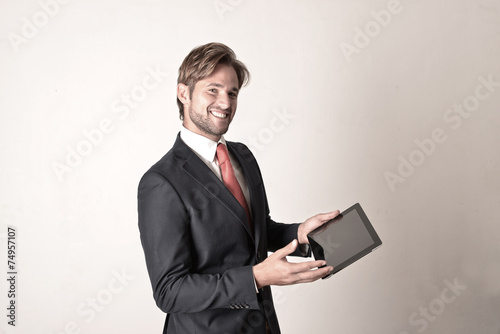 Businessman with tablet computer photo