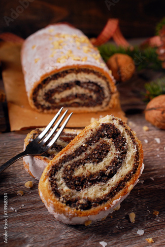 traditional christmas poppy seed cake on wooden table