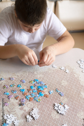Teenager boy collects puzzles from Globe