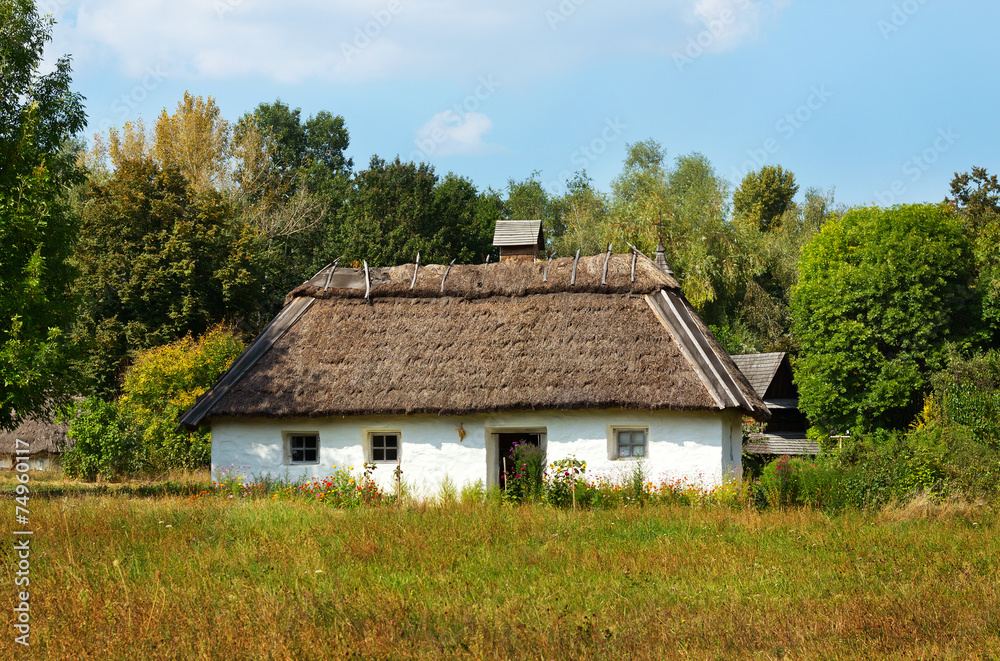 Traditional ukrainian rural cottage with a straw roof