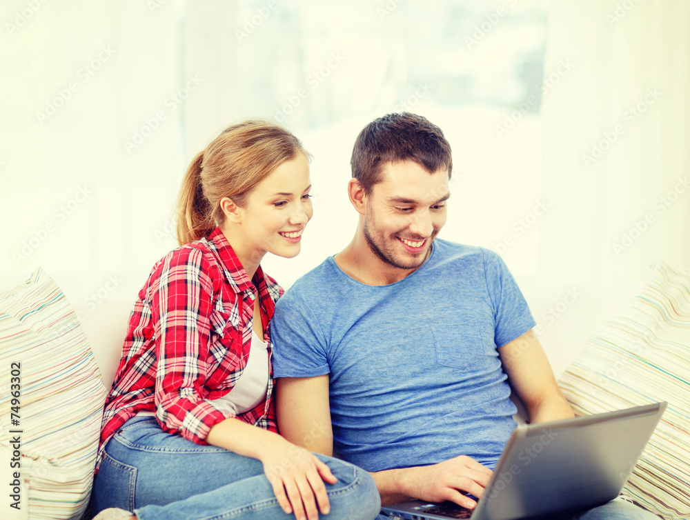 smiling couple with laptop computer at home smiling couple with laptop computer at home