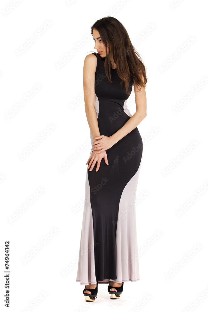 Portrait in full growth of a young woman in long evening dress Portrait in full growth of a young woman in long evening dress