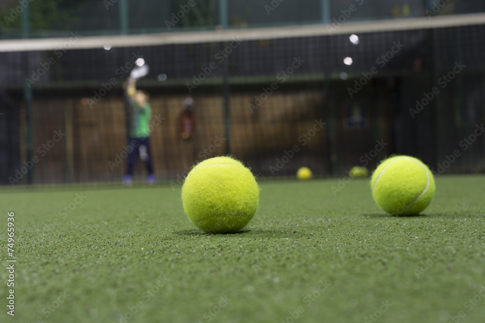 Paddle ball in astroturf court