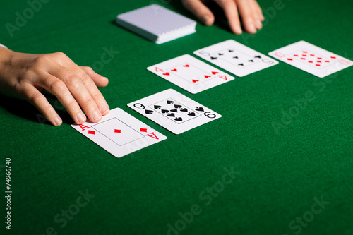 holdem dealer with playing cards