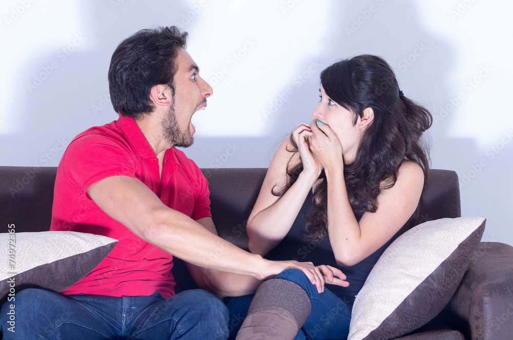 young attractive couple watching movie at home young attractive couple watching movie at home