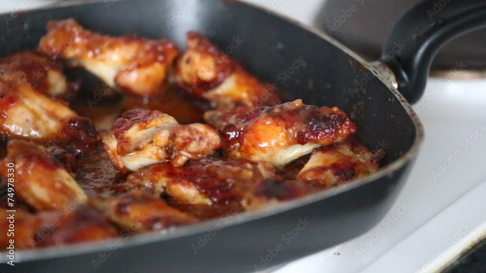 Video with delicious chicken wings and sauce in grill pan. Video with delicious chicken wings and sauce in grill pan.