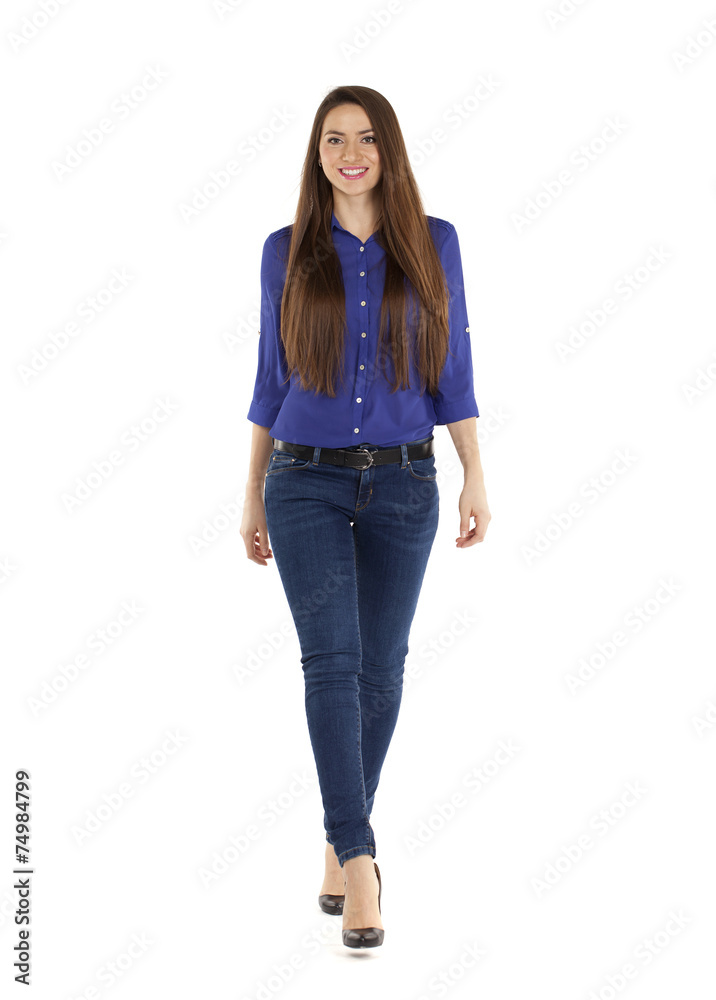 Portrait of a beautiful woman in blue jeans and blue shirt Portrait of a beautiful woman in blue jeans and blue shirt
