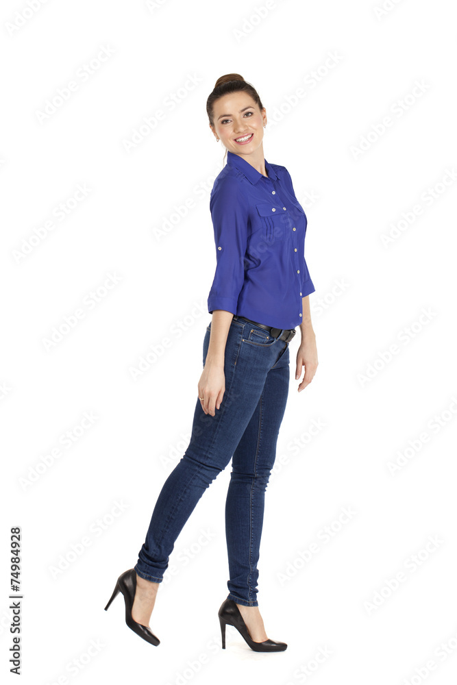 Portrait of a beautiful woman in blue jeans and blue shirt Portrait of a beautiful woman in blue jeans and blue shirt