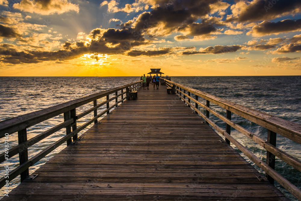 Sunset over the fishing pier in Naples, Florida.