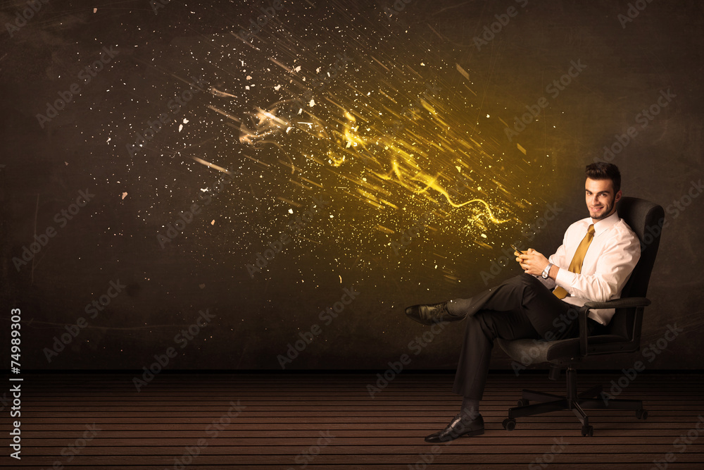 Businessman with tablet and energy explosion on background Businessman with tablet and energy explosion on background