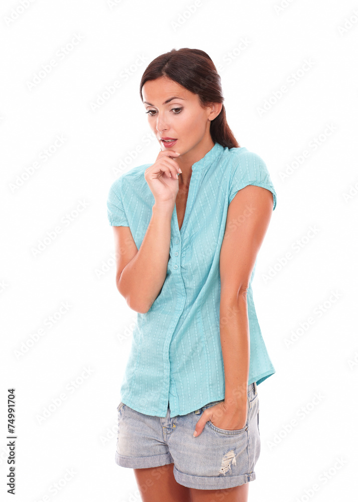 Young lady in shorts with hand on chin Young lady in shorts with hand on chin