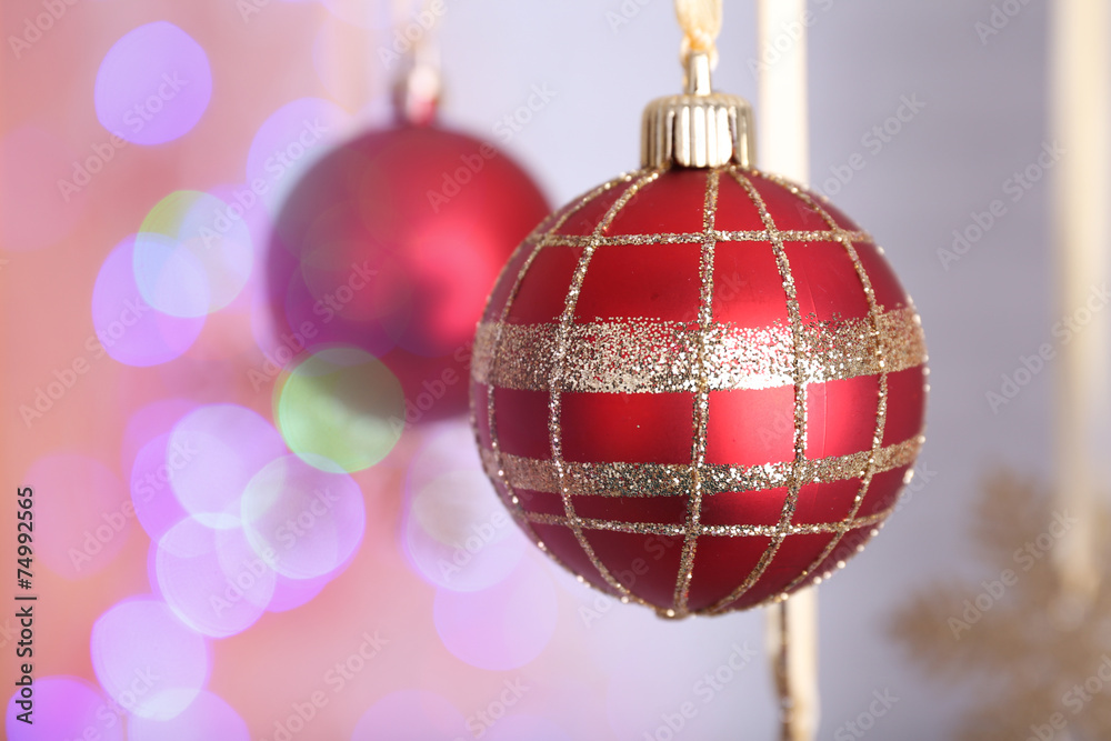 Christmas decorations hanging on festive background Christmas decorations hanging on festive background