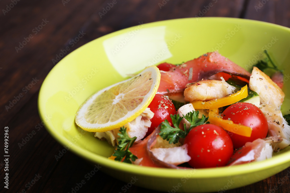 Fresh fish salad with vegetables