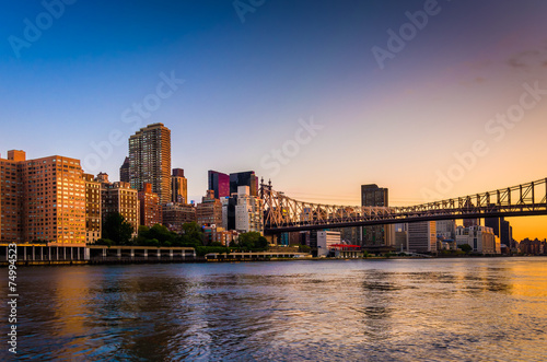 The Queensboro Bridge and Manhattan skyline at sunrise, seen fro