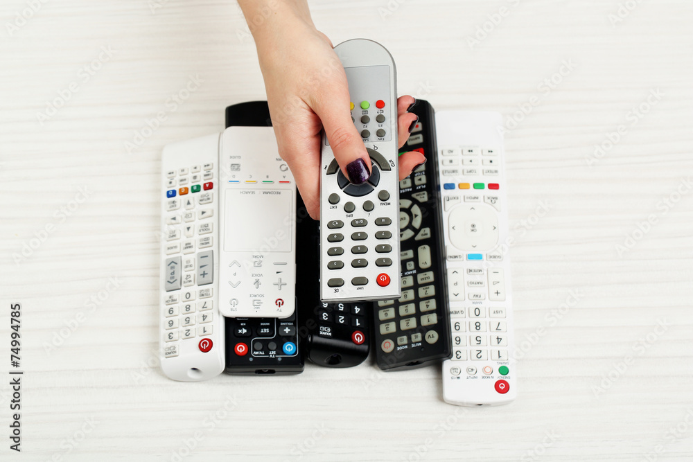 Many remote control devices on table Many remote control devices on table
