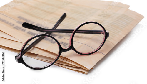 Glasses and newspapers, isolated on white