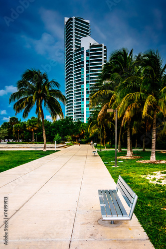 Walkway and distant skyscraper seen at South Pointe Park, Miami