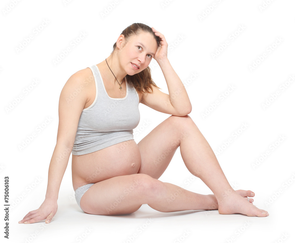 Sad pregnant woman on white background. Prenatal care concept. Sad pregnant woman on white background. Prenatal care concept.
