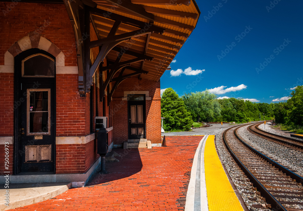 Wall Mural The historic railroad station along train tracks in Point of Roc