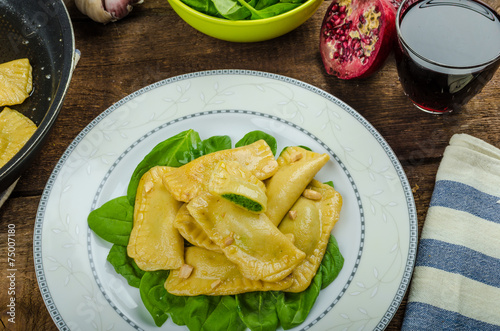 Homemade ravioli stuffed with spinach and ricotta