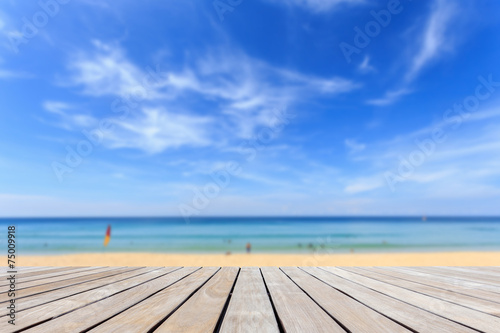 Grey wood decking and tropical beach