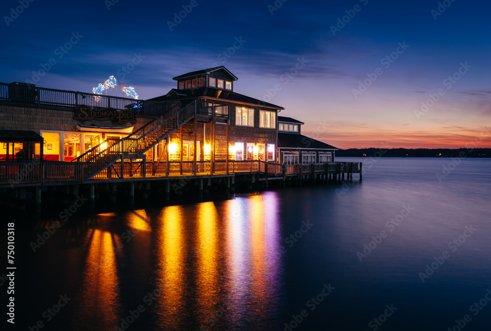 Solomon's Pier Restaurant reflecting in the Patuxent River at su